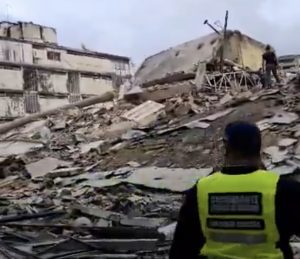 Screenshot Seek the Gospel Truth Rubble and Collapsed Buildings After a Disaster with a Responder in a Bright Yellow Vest Surveying the Site